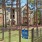 a fenced in yard with a building in the background