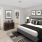 a bedroom with a bed and a toilet