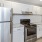 a kitchen with white cabinets